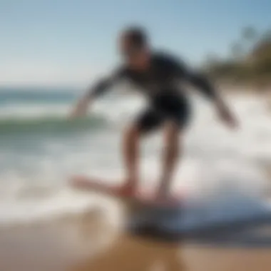 A beginner learning to balance on a surf ripstik on the beach