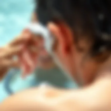 Effective Drying Techniques for Ears A person using a towel to dry their ear after swimming.