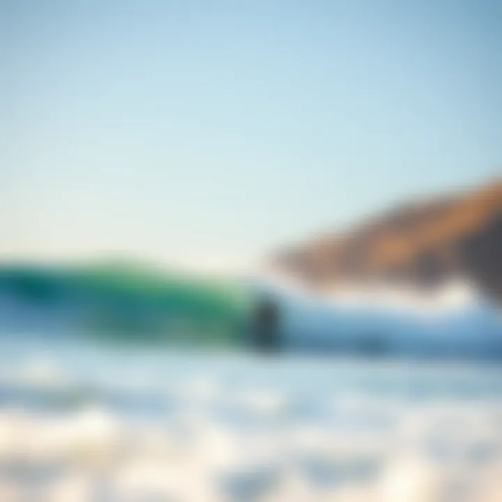 Surfer catching a wave at a popular surf spot in Big Sur