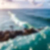 Aerial view of North Shore waves crashing against the rocks