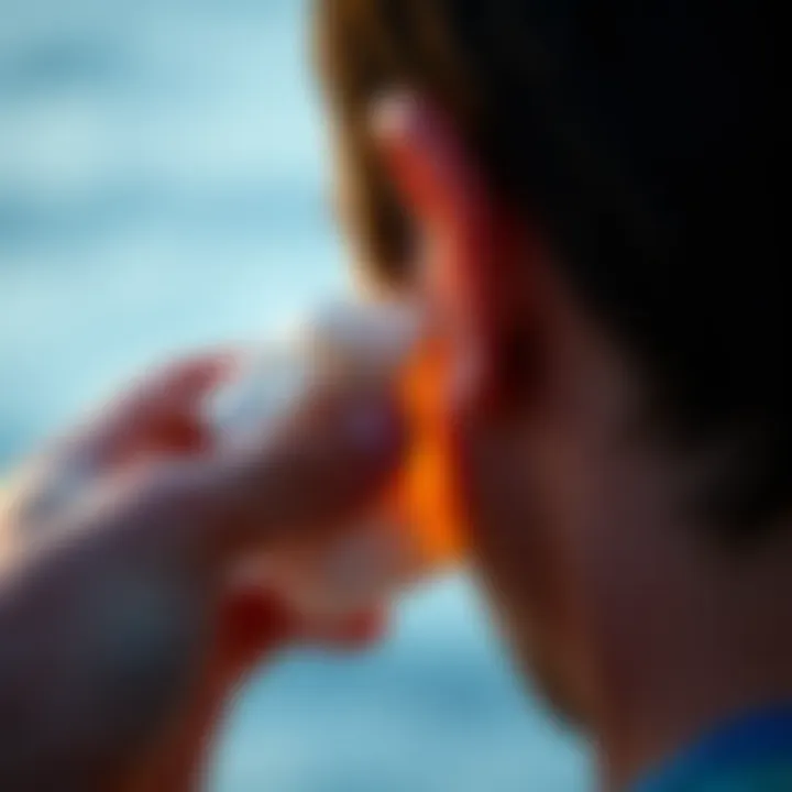 Illustration of warm compress being applied to the ear to relieve trapped water