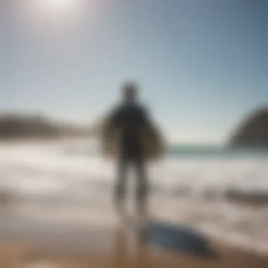 A surfer standing on the beach preparing to ride the waves with a focused expression.