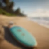 A vibrant longboard surfboard displayed on the beach