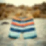 Stylish boardshorts displayed on a sandy beach