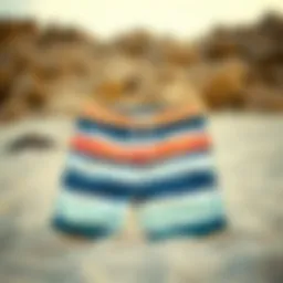 Stylish boardshorts displayed on a sandy beach
