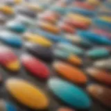 A close-up view of various epoxy resin types available for surfboard construction.
