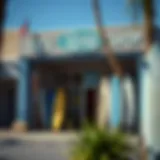 Exterior view of Jacks Surf Shop showcasing surfboards