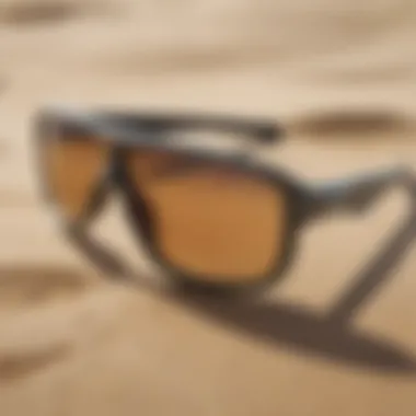 Close-up of Oakley surf gear on a sandy beach