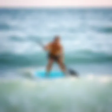 An instructor demonstrating proper paddle boarding techniques