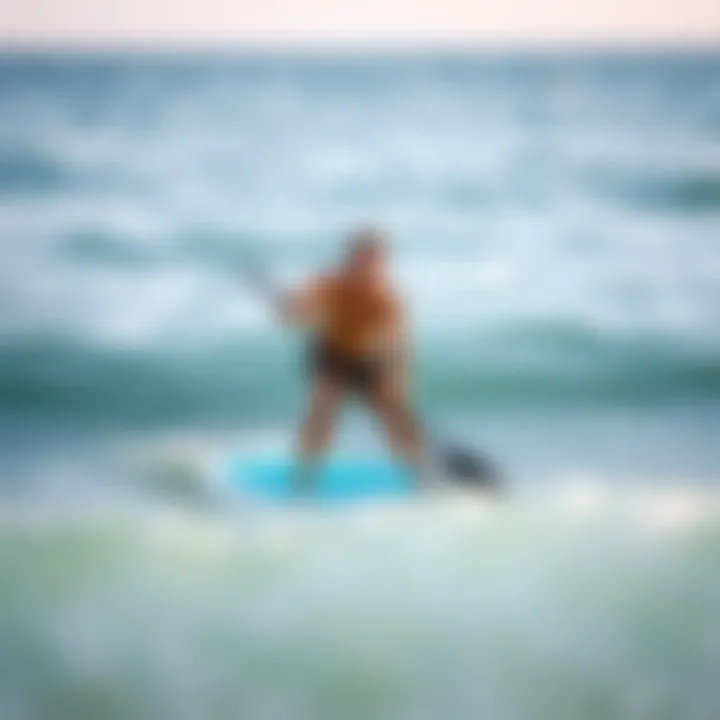 An instructor demonstrating proper paddle boarding techniques