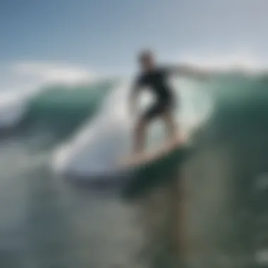 A surfer riding a wave on a second hand surfboard, showcasing performance