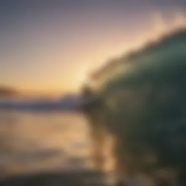 A surfer catching a wave at sunset in Ventura