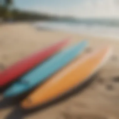 A close-up of surfboards lined up on the beach