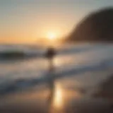 A stunning sunrise over the ocean with surfers paddling out