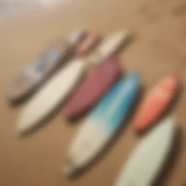 A variety of skim boards displayed on a sandy beach