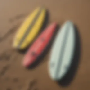 Comparison of traditional and foldable surfboards on the beach.