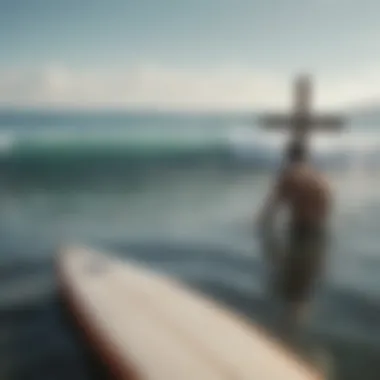 A surfer contemplating on a board with a cross in the background