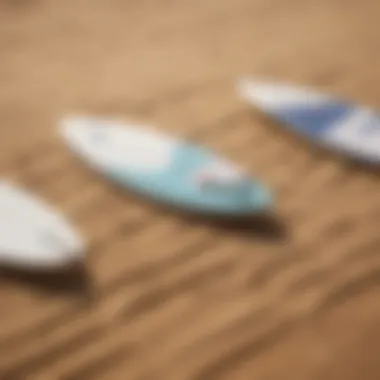 Surfboards lined up on the sandy shore of Poipu