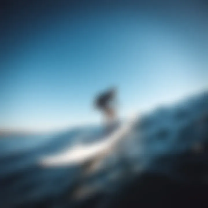 Surfer gliding over the water using a foil surfboard