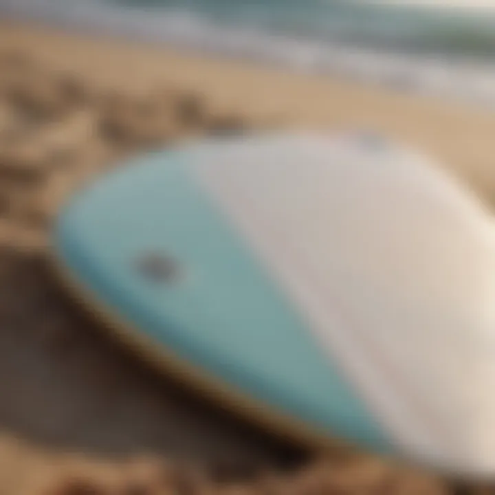 Close-up of surfboard on the beach