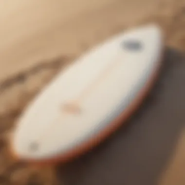 Close-up of surfboard on the sand