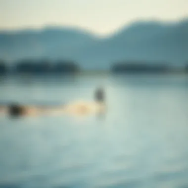 Inland Surfing on a Tranquil Lake A serene lake with a surfer riding a wake created by a boat, showcasing the beauty of inland surfing.