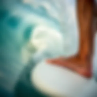 Mastering Technique on Challenging Waves A close-up of a surfer's feet on a board, navigating through a challenging wave, demonstrating skill and technique.