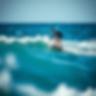 Surfer riding a hydrofoil surfboard over the water