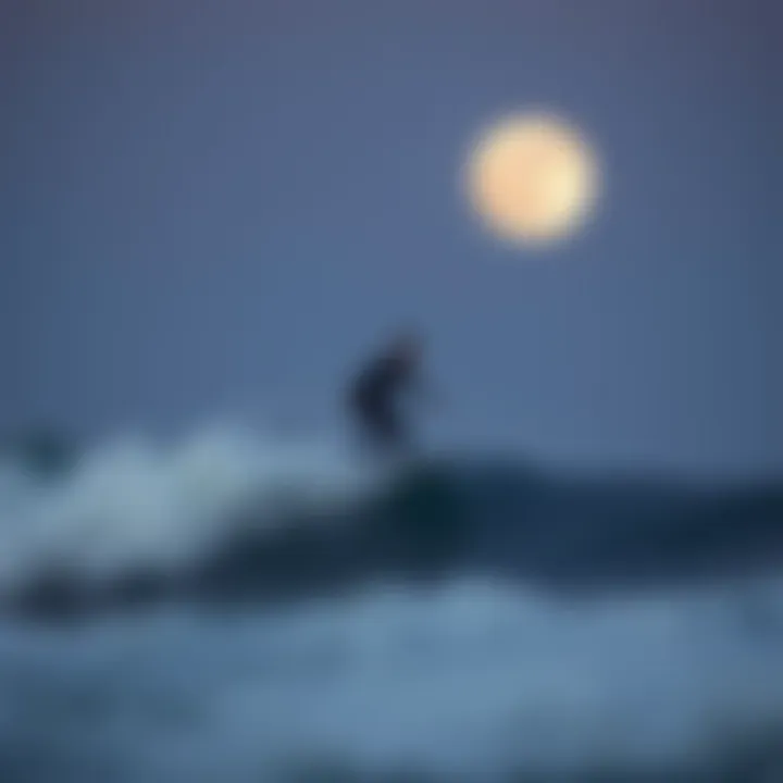 Surfer riding a wave during a full moon