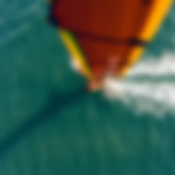 Aerial view of a wing foiler gliding over the water