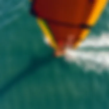 Graceful Aerial Perspective of Wing Foiling Aerial view of a wing foiler gliding over the water