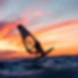 Naish wing foiling in action against a vibrant sunset