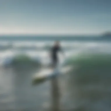 A beginner surfer practicing on a calm day at a local surf school