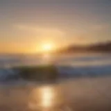 Golden sunset over a California surf beach with waves crashing