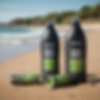 Eco-friendly neoprene cleaner bottles on a sandy beach