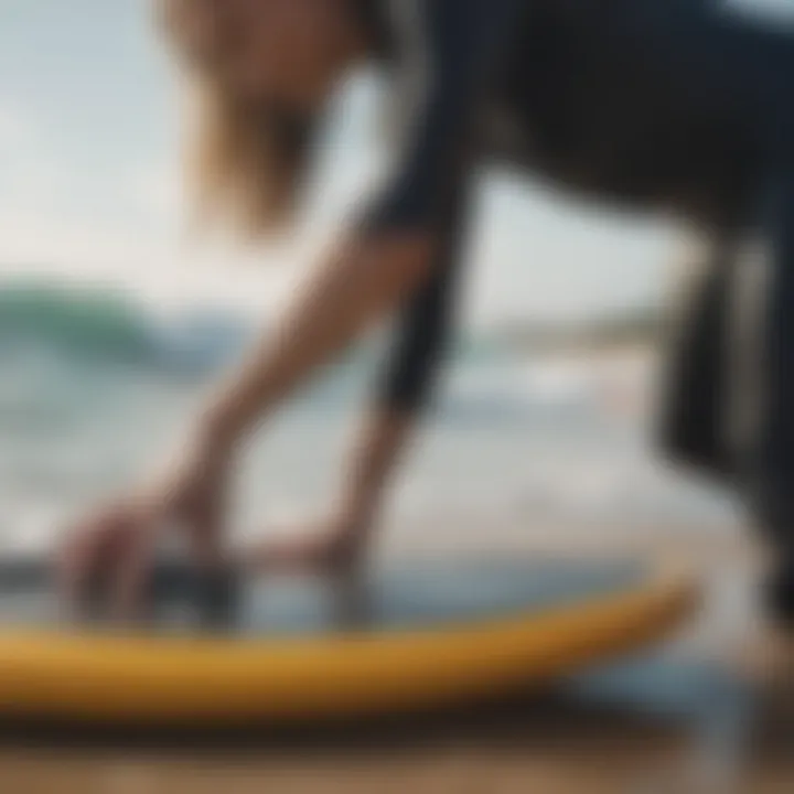 Surfer cleaning neoprene gear with a soft brush