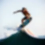 Dynamic surfboarder executing a trick on a quarter pipe ramp