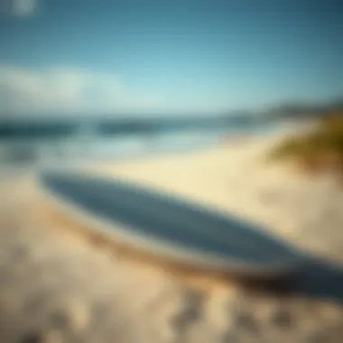 Elegantly designed Saint Laurent surfboard resting on a sandy beach