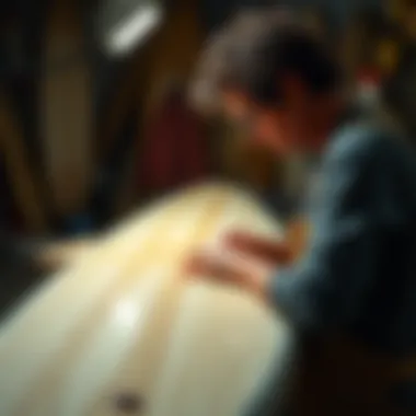 An artist customizing a surfboard to meet specific surfer needs