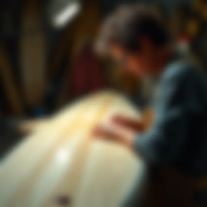 An artist customizing a surfboard to meet specific surfer needs