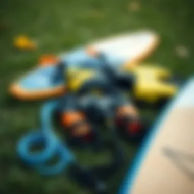 Essential Wakesurfing Gear An overview of essential wakesurfing gear laid out on the grass, including ropes and life jackets