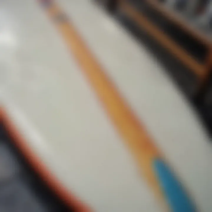 A surfboard being coated with fiberglass epoxy resin