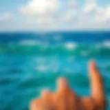 Symbolic representation of the hang loose gesture against a vibrant ocean backdrop