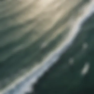 Aerial view of surfers riding waves with varying points of sail