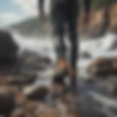 Surfer wearing reef boots on rocky shore