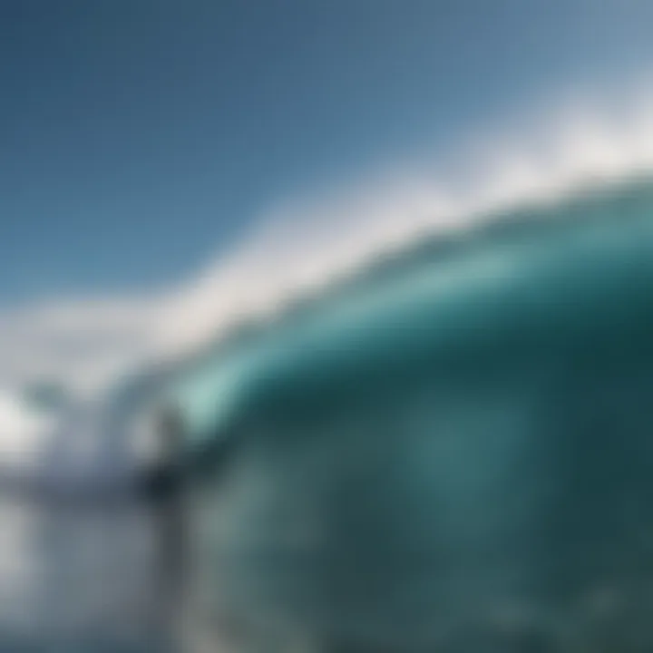 Surfer riding a wave under clear skies